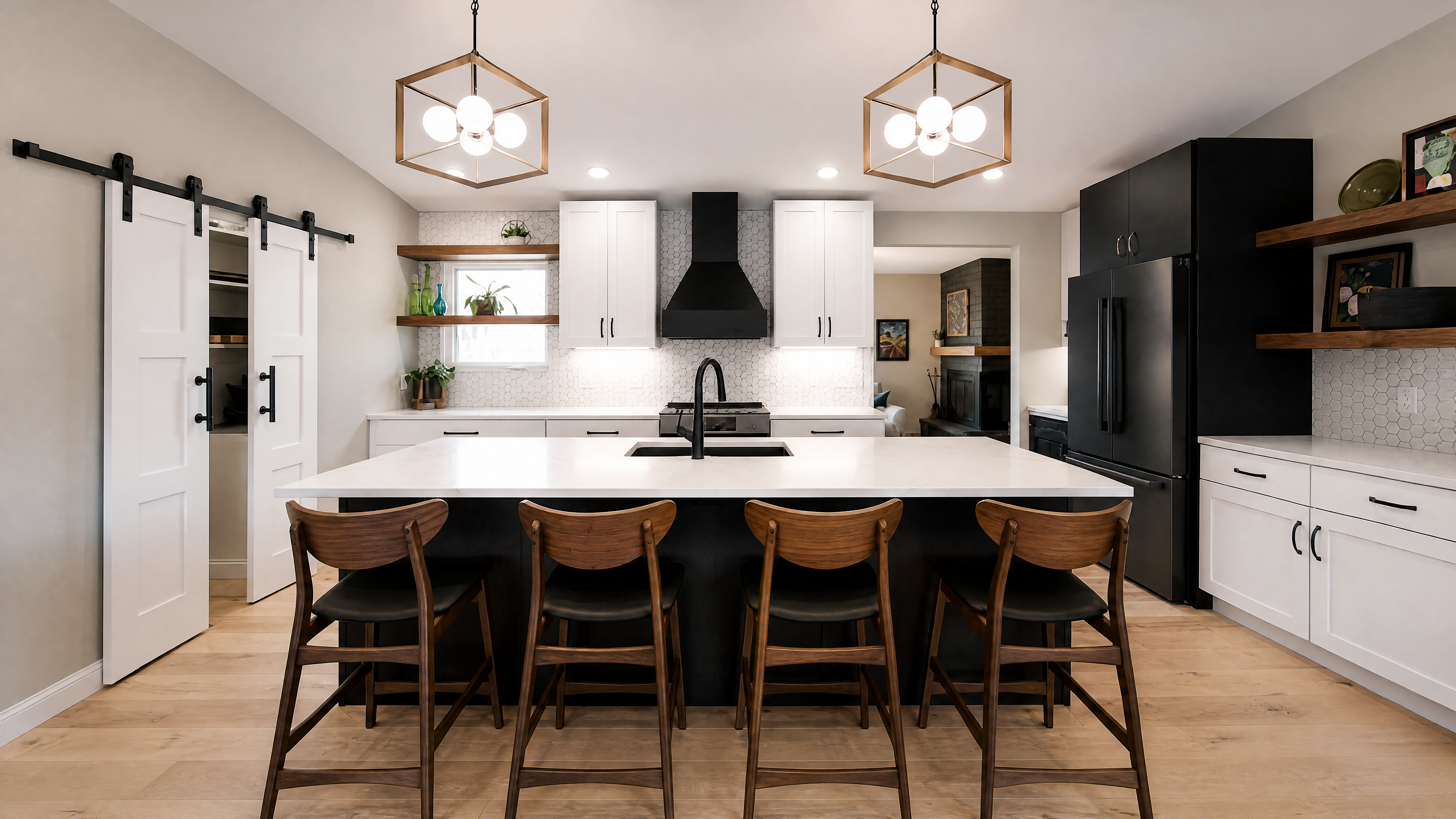 A calm white-oak kitchen with matte-black accents